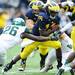 Michigan senior quarterback Denard Robinson looks for a hole to run through during second quarter at Michigan Stadium on Saturday afternoon. Melanie Maxwell I AnnArbor.com